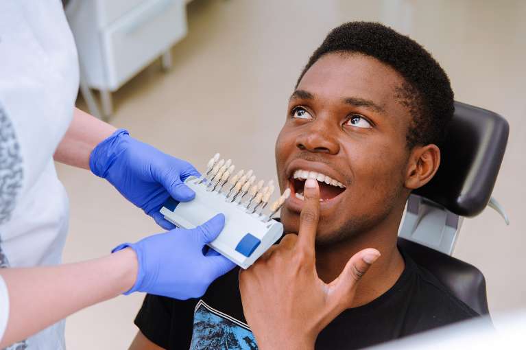 man sitting in a dental chair
