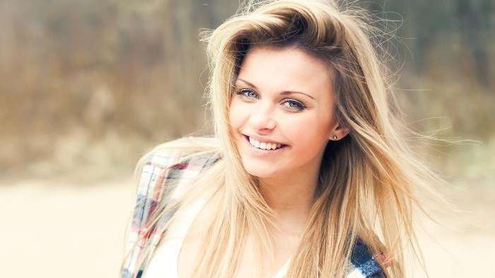Woman after cosmetic dentistry in vienna va