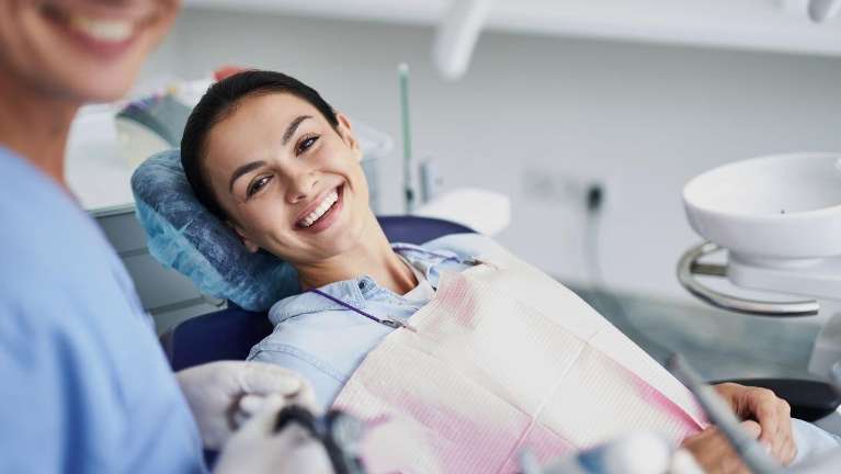woman getting dental cleaning