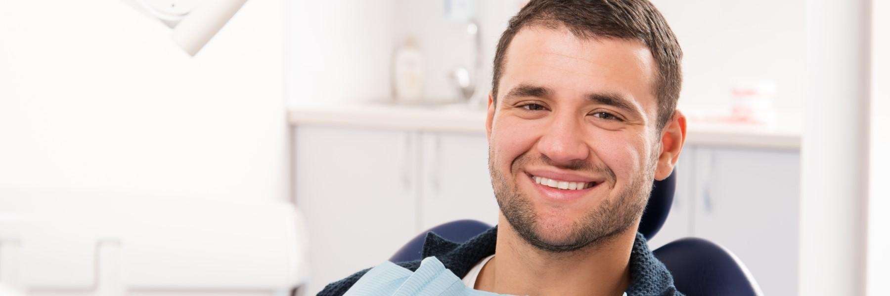 man sitting in a dental chair
